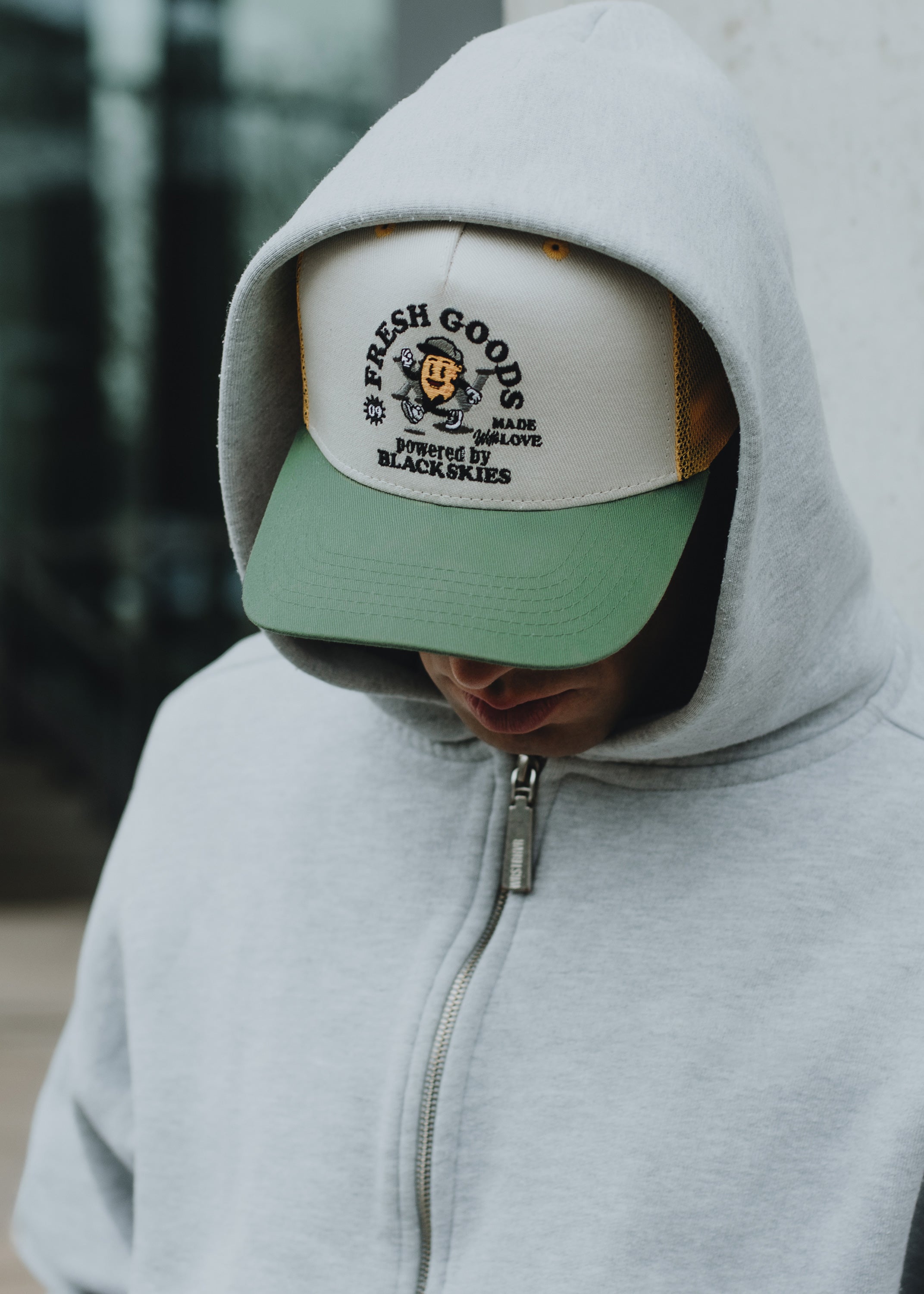 Blackskies-15th-Anniversary-Trucker-Cap-Lemon-Model-2