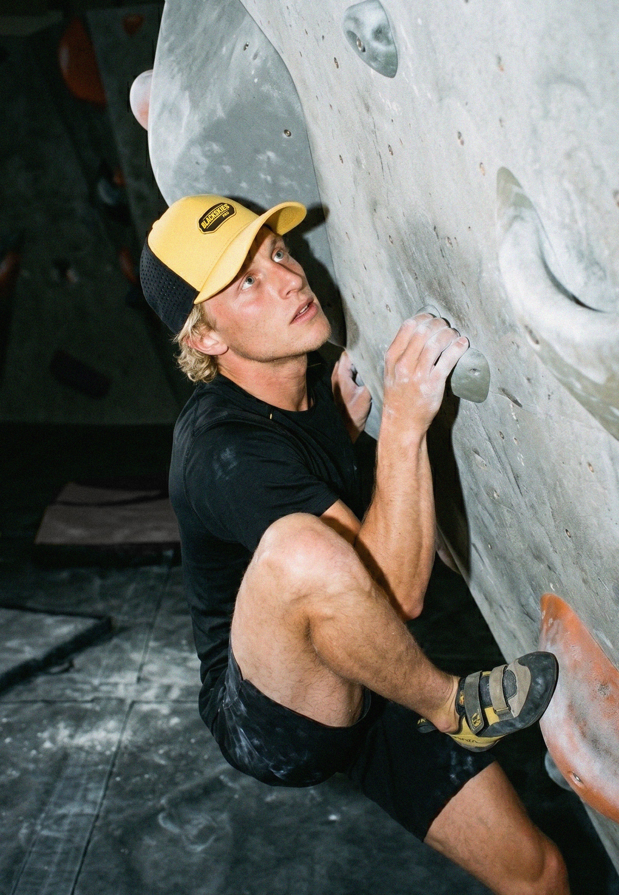 Person climbing a rock wall indoors