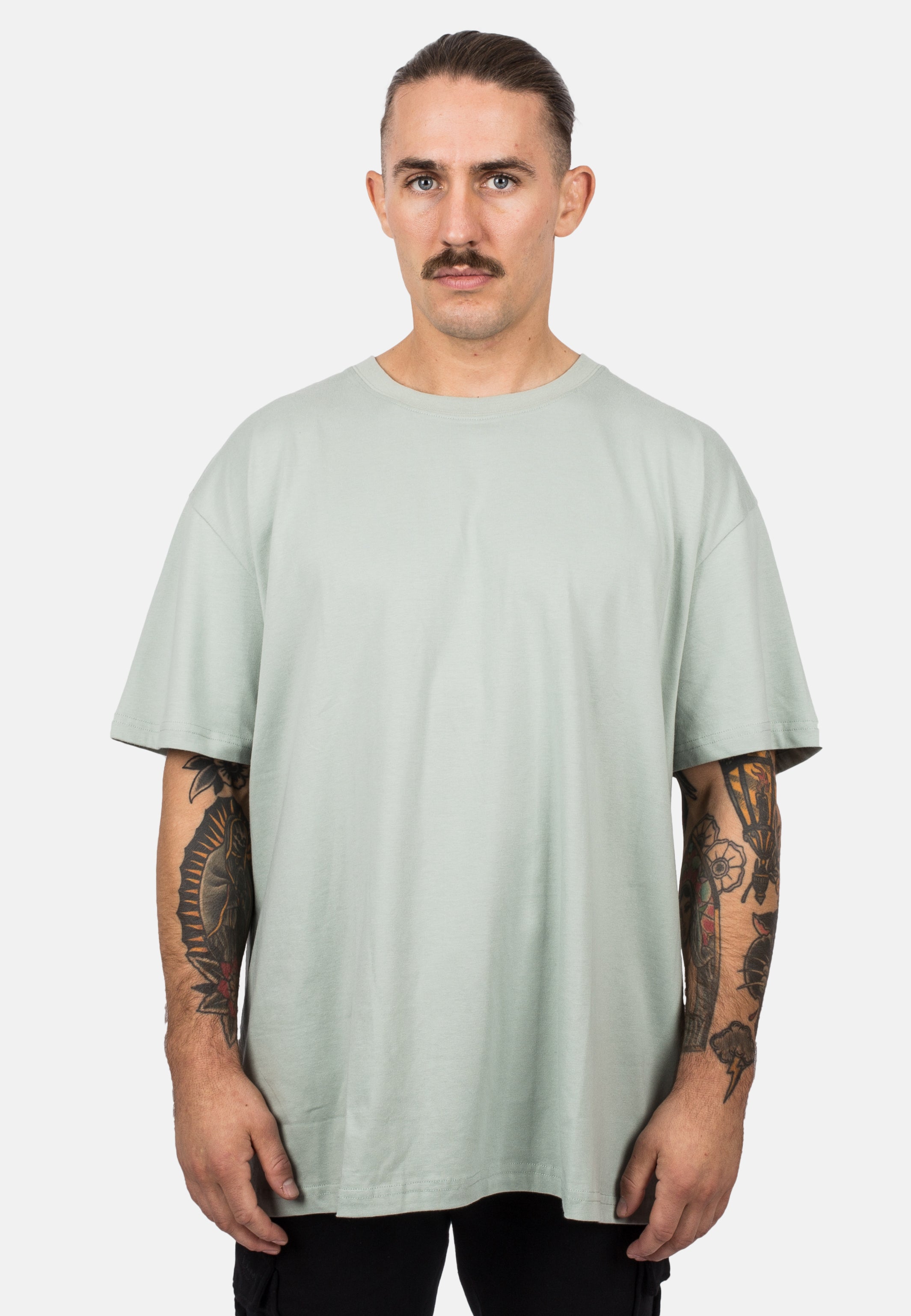 Blackskies-Unisex-Oversized-T-Shirt-Sage-Male-Model-Front